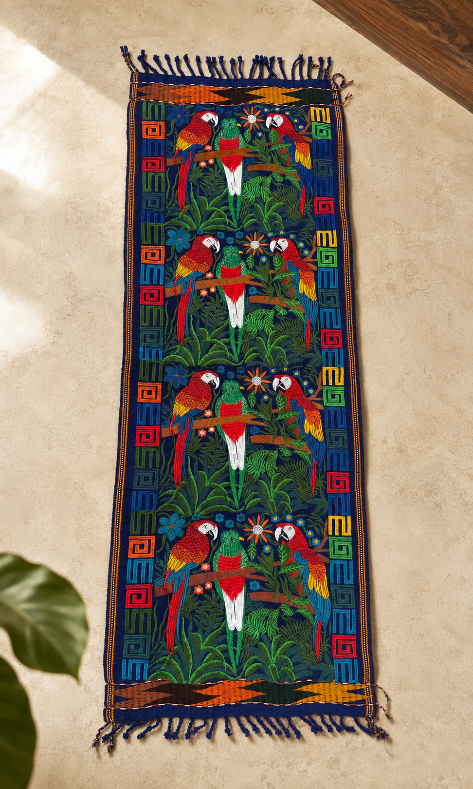 Embroidered Tapestry with four colorful bird and botanical panels, geometric borders and navy-blue fringes.